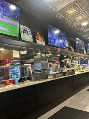 Pizza Pete's counter where fresh pizzas are made daily